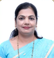 Portrait of Dr Jyoti Vinod Bhala, a general Ayurveda practitioner with short black hair, smiling at the camera.